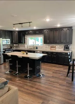 Riggs Roofing and Remodeling Logo