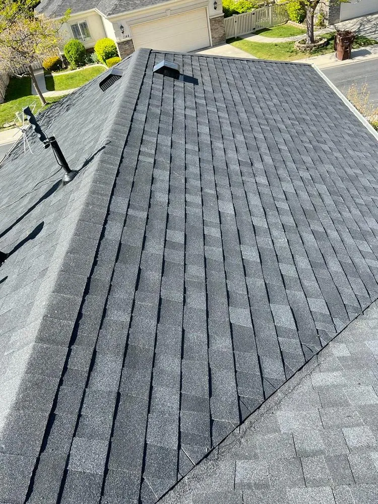 Slide of Rigo's Roofing Company