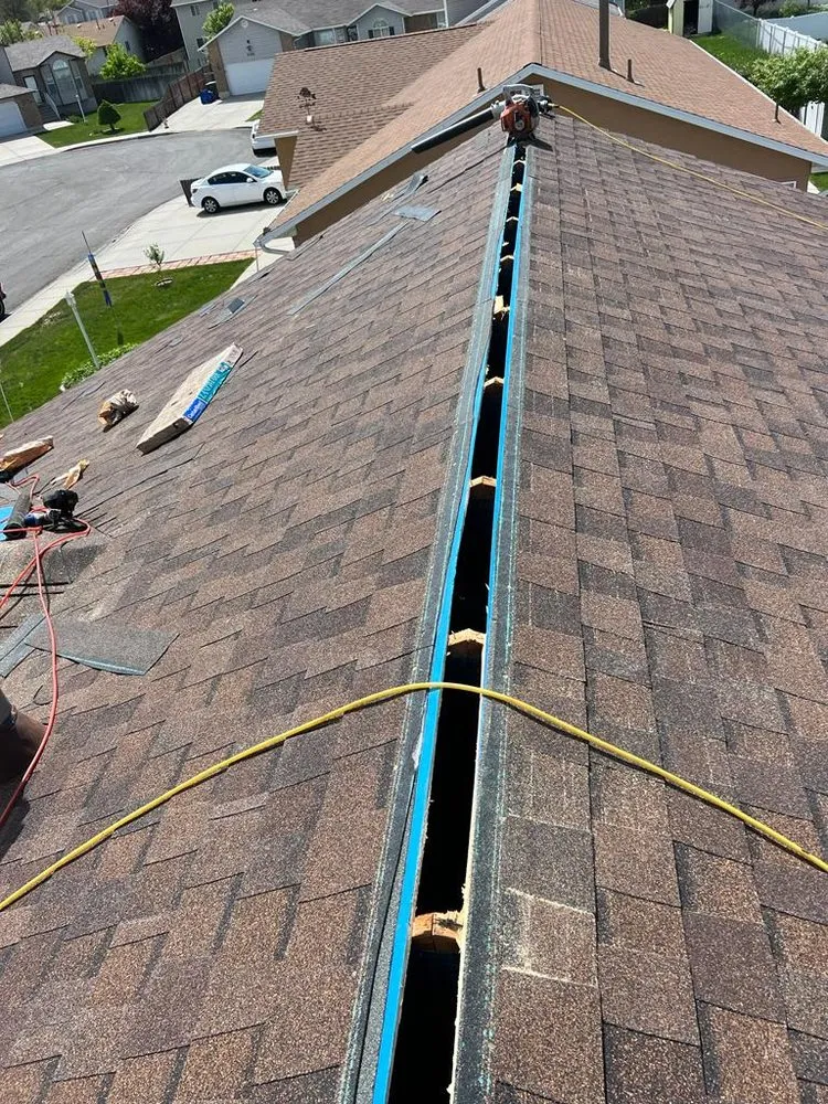 Slide of Rigo's Roofing Company