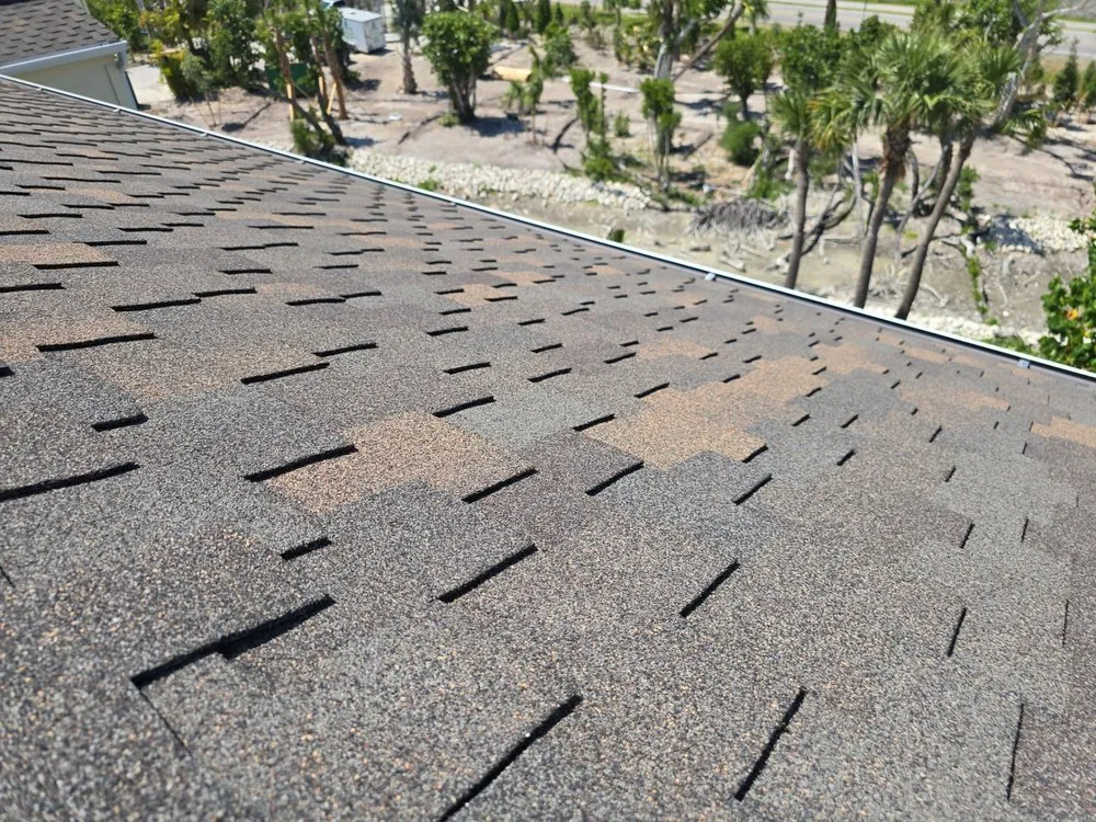 Slide of Rigos Roofing Installers