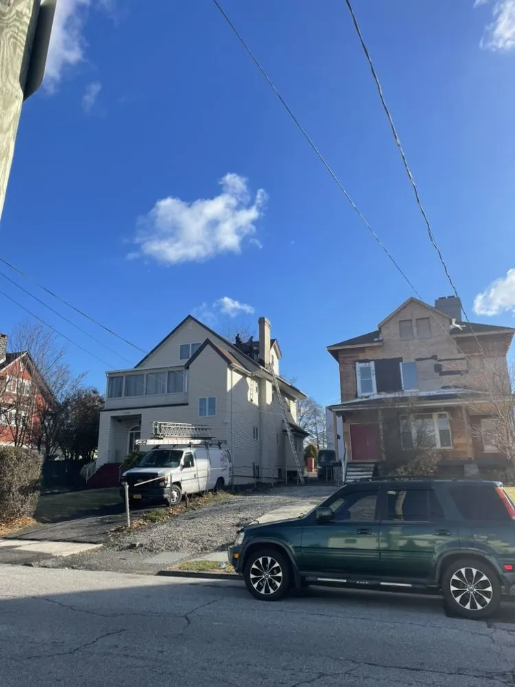 Slide of RJM Best Roofing