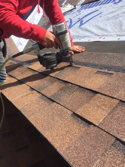 Slide of Rock's Roofing