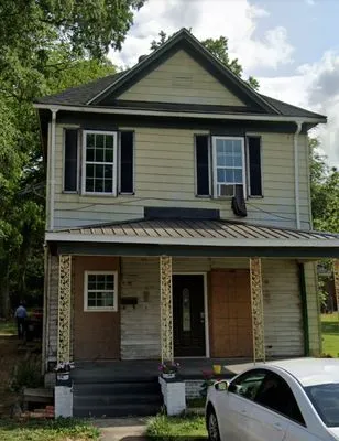 Rolas Roofing & Construction Logo