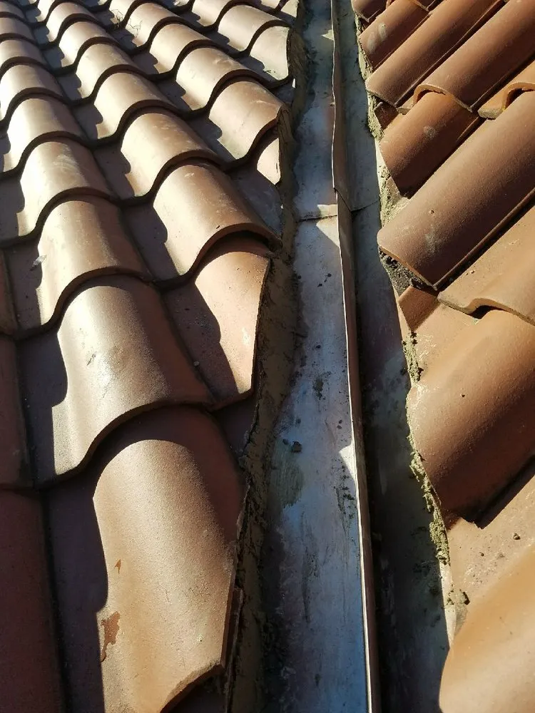 Slide of Romano Roofing
