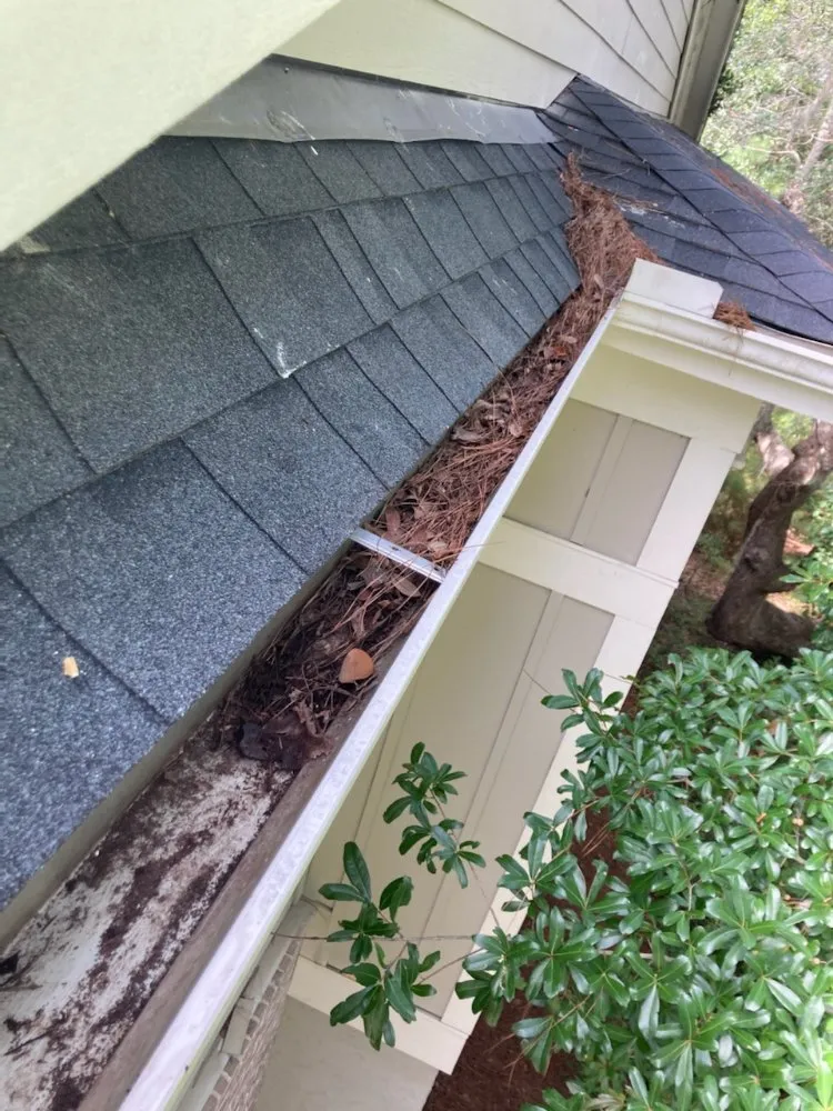 Slide of Roof and Gutter Cleaning