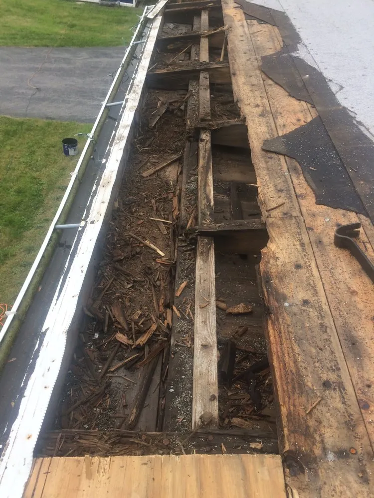 Slide of Roof Top Maintenance & Gutter Services