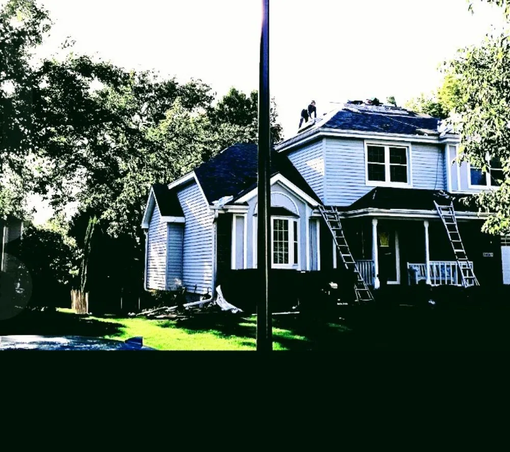 Slide of Roofer Mike's Roofing Siding & Gutters