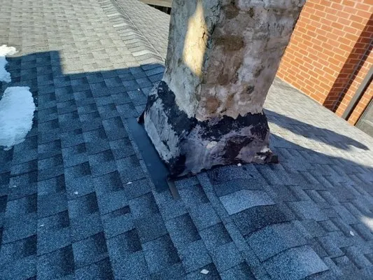 Roofing & Tuckpointing Services Logo