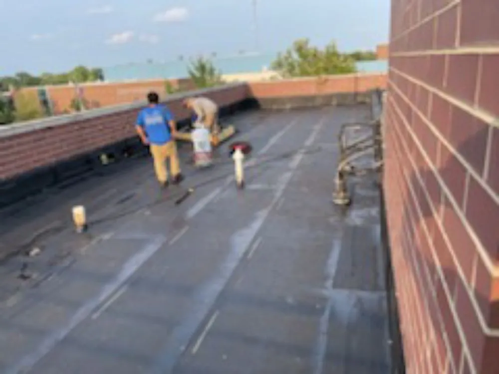 Slide of Roofing Techs