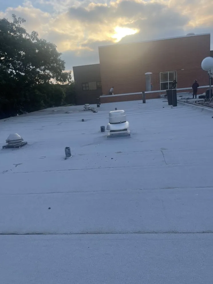 Slide of Roofing Techs