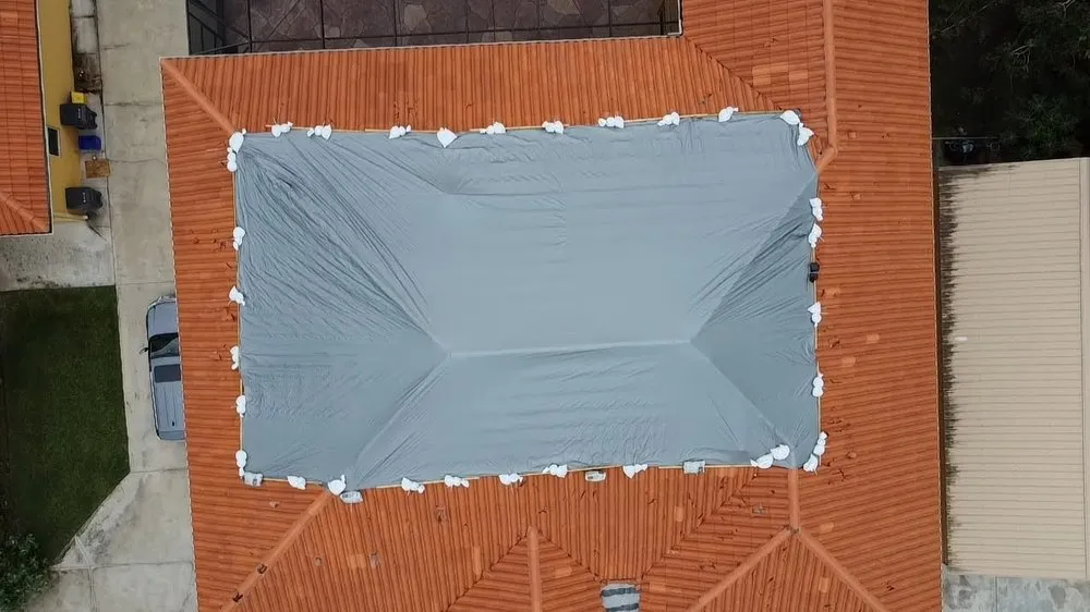 Slide of RoofTop Tarping