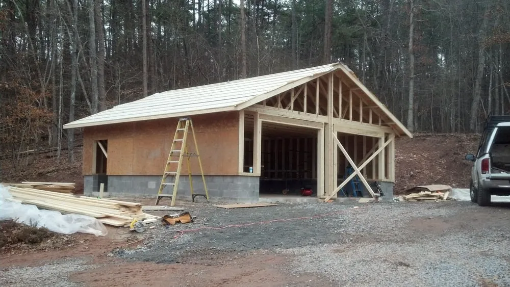 Reliable metal roofing installation with free inspection in Dillsboro, NC by Rough to Finish
