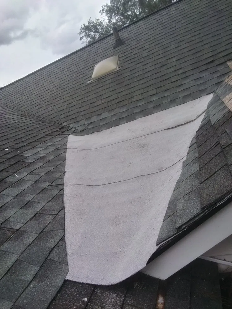 Slide of Roy's Roof Repair