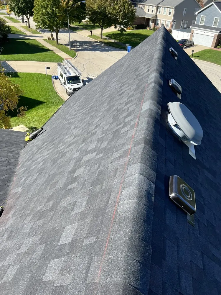 Slide of RT Roofing Exteriors