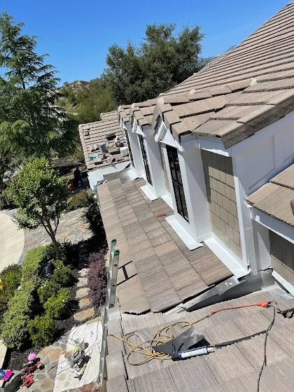 Slide of Rudy’s roofing