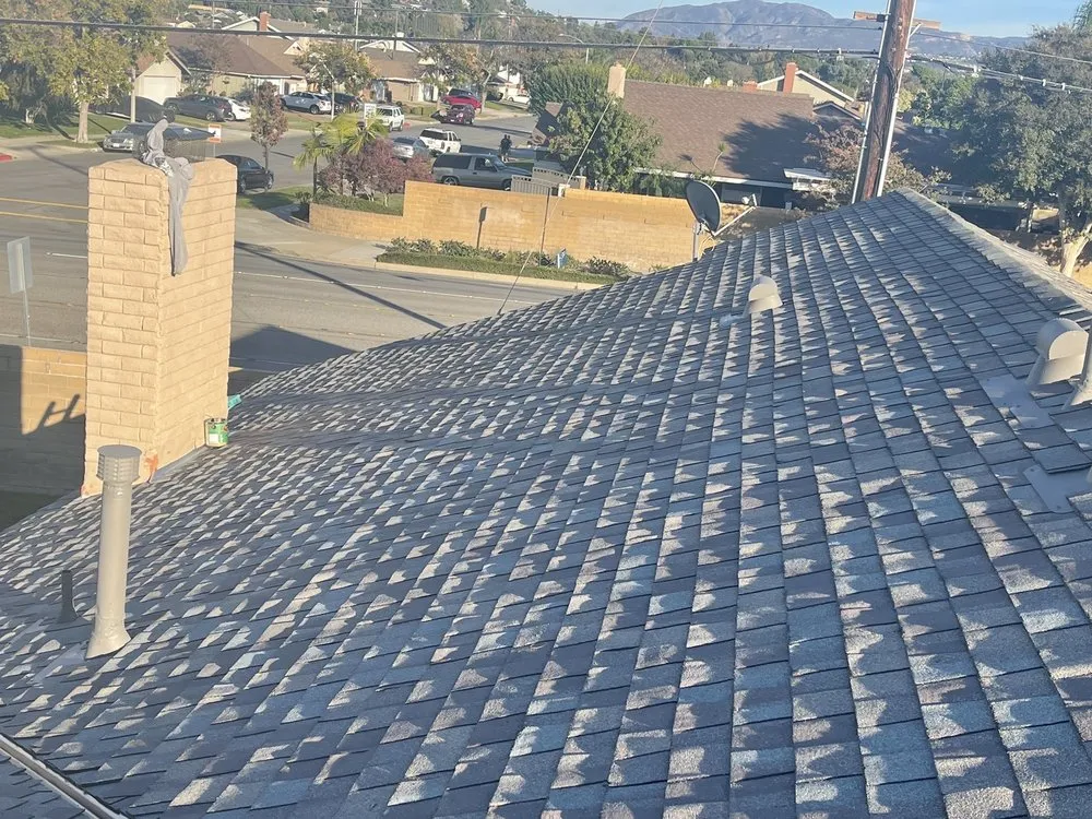 Slide of Rudy’s roofing