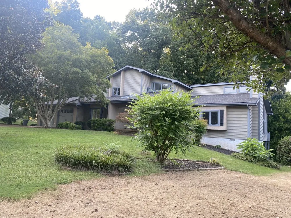 Slide of Russells Roofing Knoxville