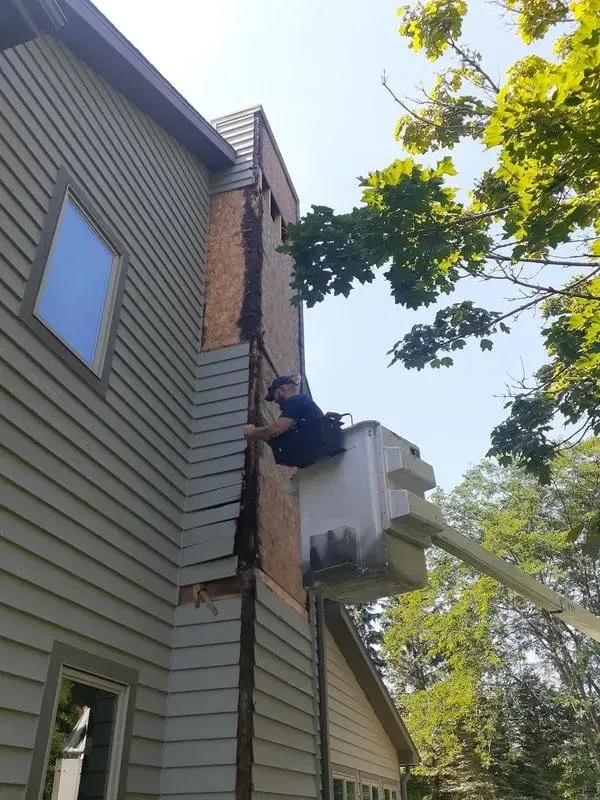 Licensed storm damage roof repair in Saint Cloud, WI by S & S Painting & Restoration