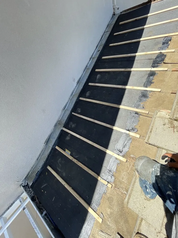 Slide of Samperios Roofing