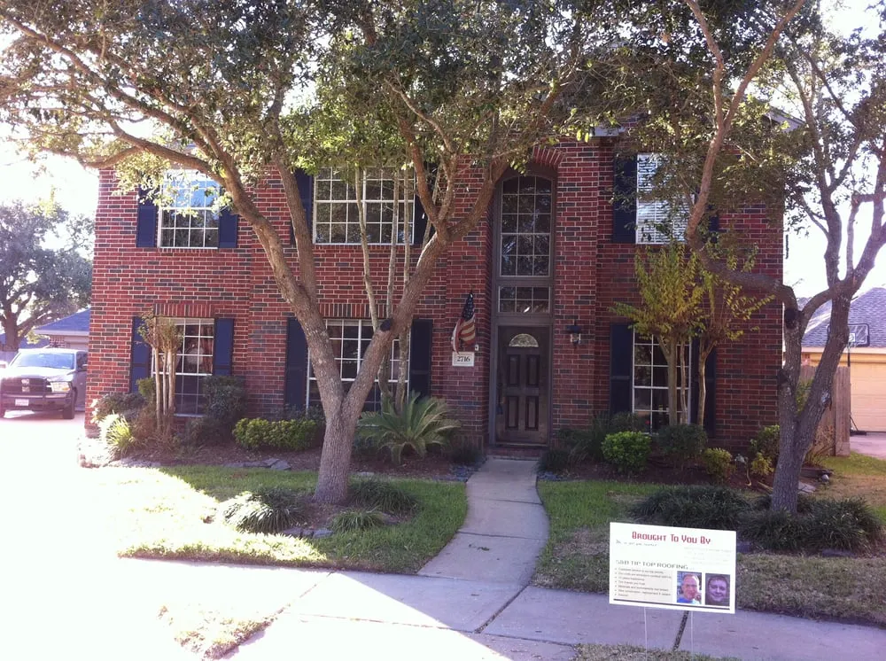 Slide of S&B Tip-Top Roofing