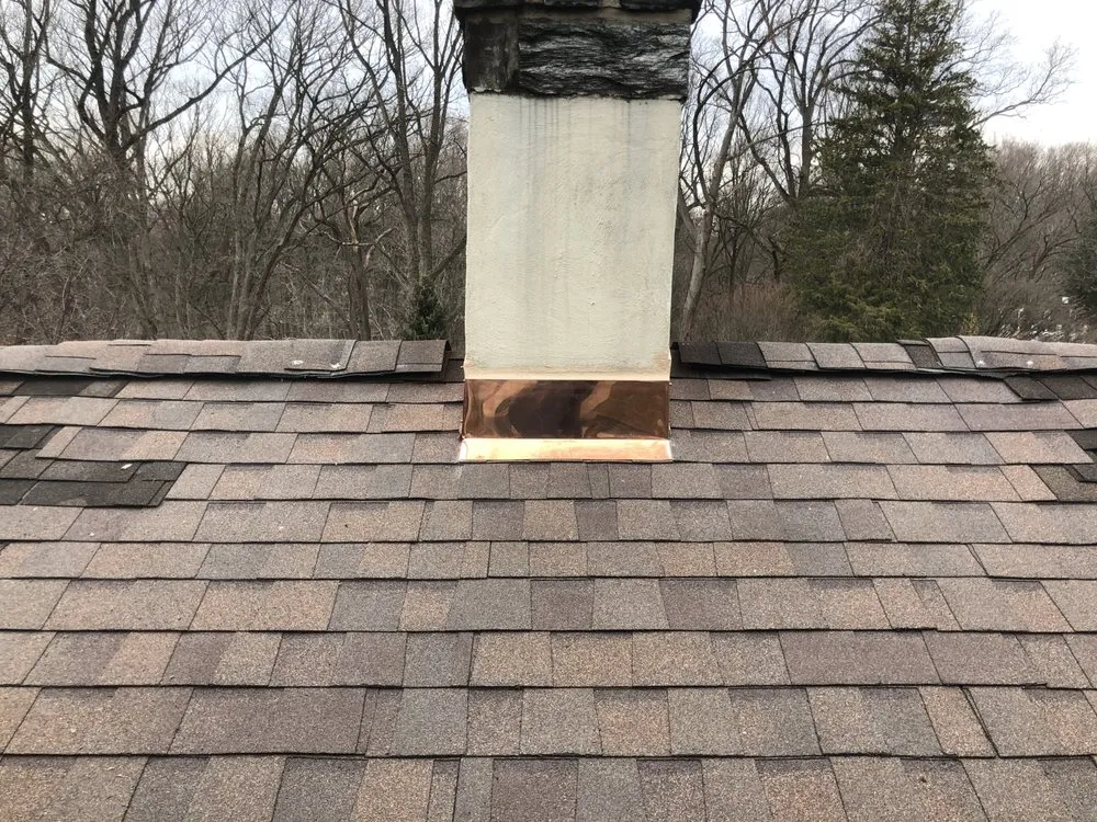 Professional storm damage roof repair for residential properties in Wynnewood, PA by Scheinfield Contractors