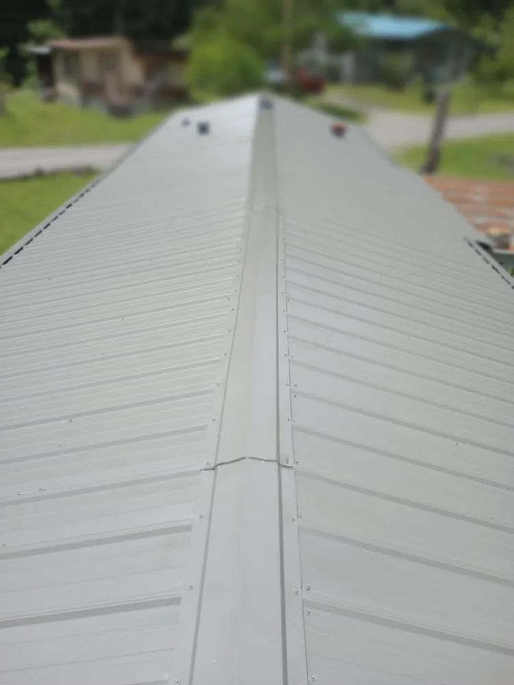 Local storm damage roof repair in War, WV by Scotties Roofing