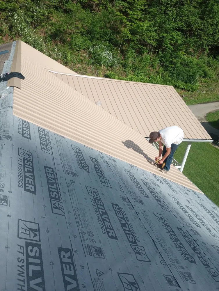 Local storm damage roof repair in War, WV by Scotties Roofing