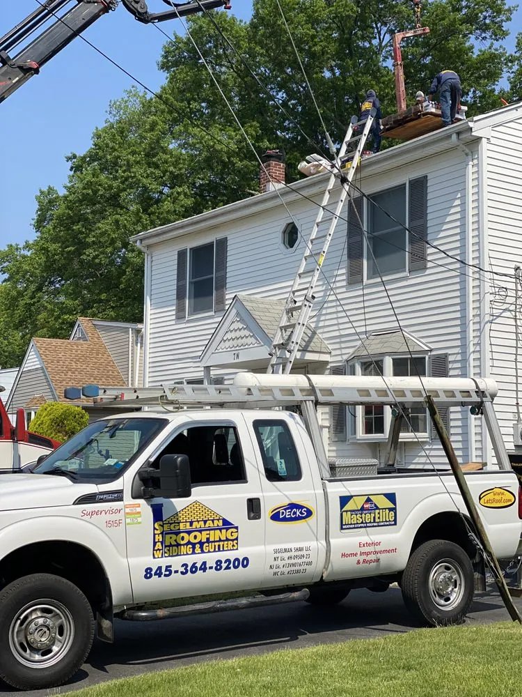 Slide of Segelman Shaw Roofing Siding & Gutters