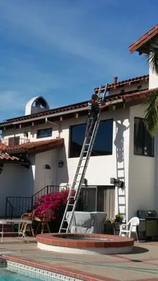 Sergio's Roofing & Rain Gutters Logo