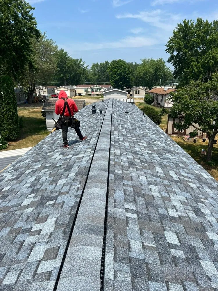 Licensed roof installation in Hilltop, MN by Seus Guaman