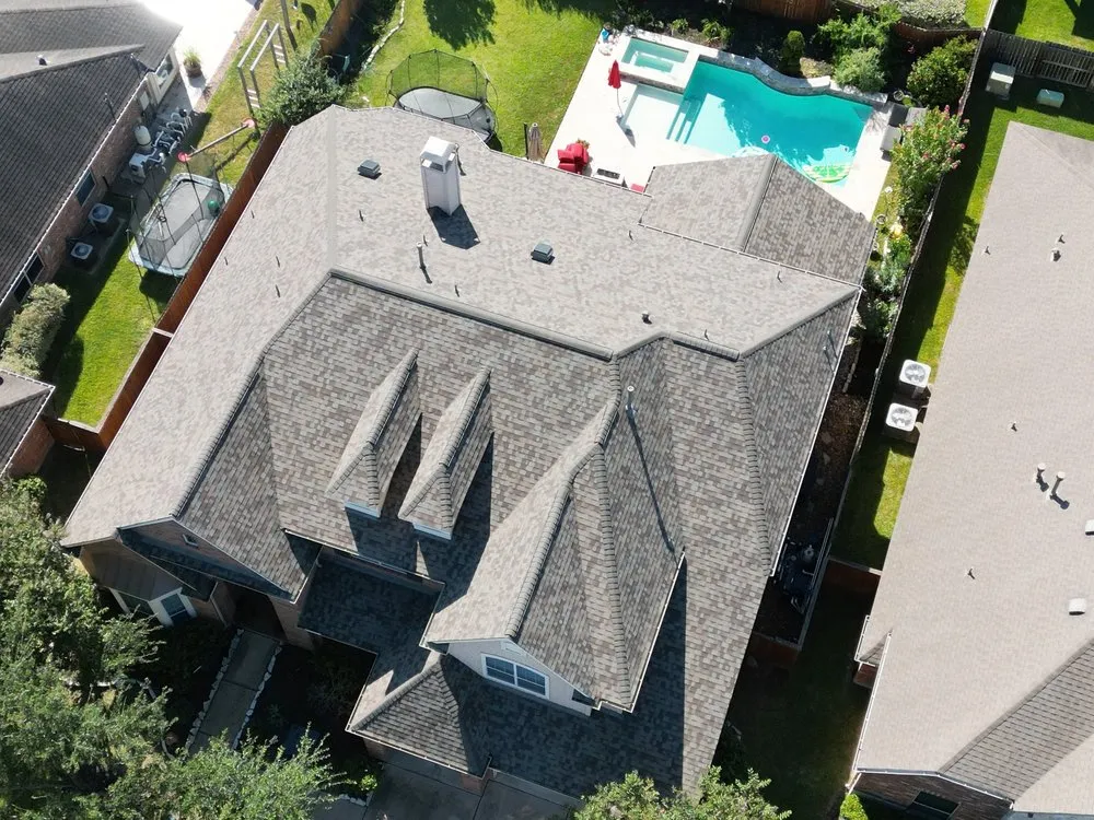 Slide of Shingle Hut Complete Roofing Services