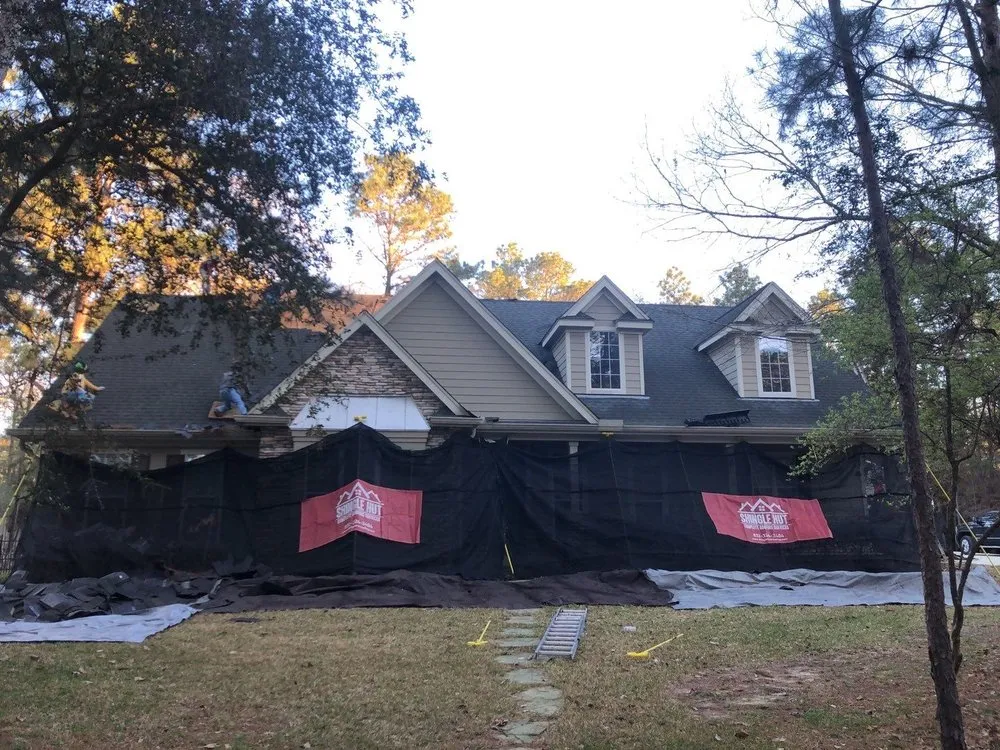 Slide of Shingle Hut Complete Roofing Services