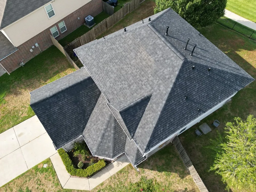 Slide of Shingle Hut Complete Roofing Services