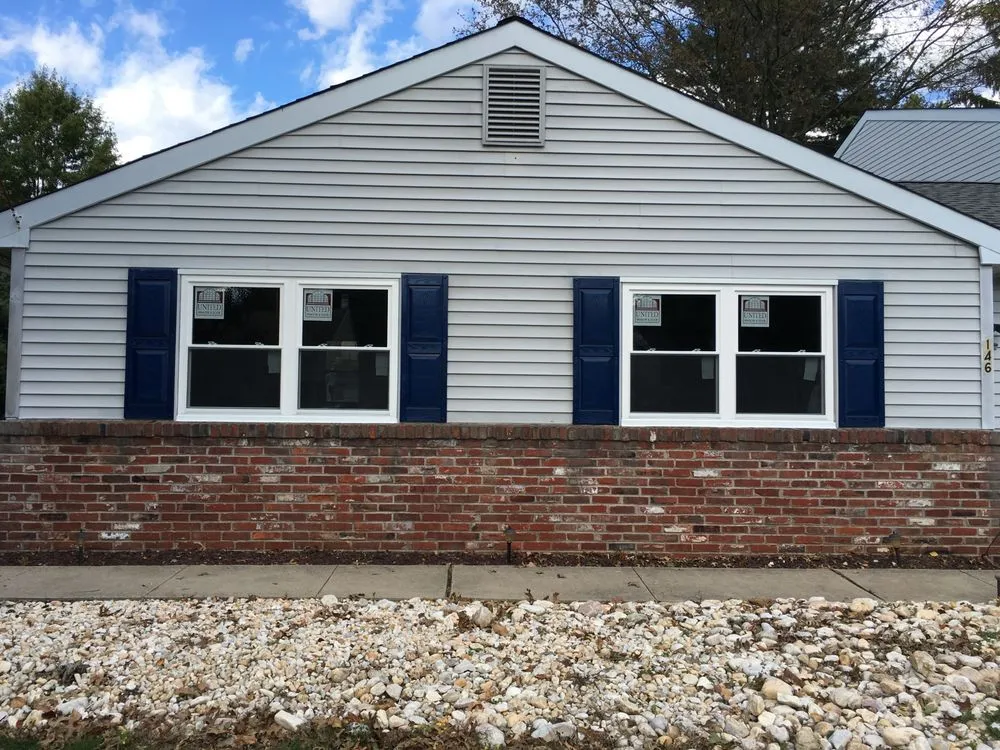 Licensed flat roof repair after storm damage in Ewing Township, NJ by Siding & Windows Wizards