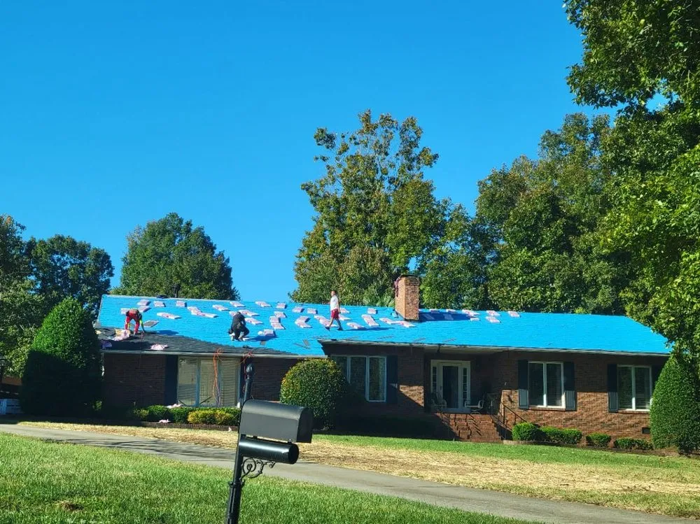 Slide of Sky Blue Roofing