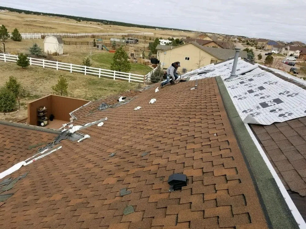 Licensed shingle roofing service in Peyton, CO by Skylight Masters