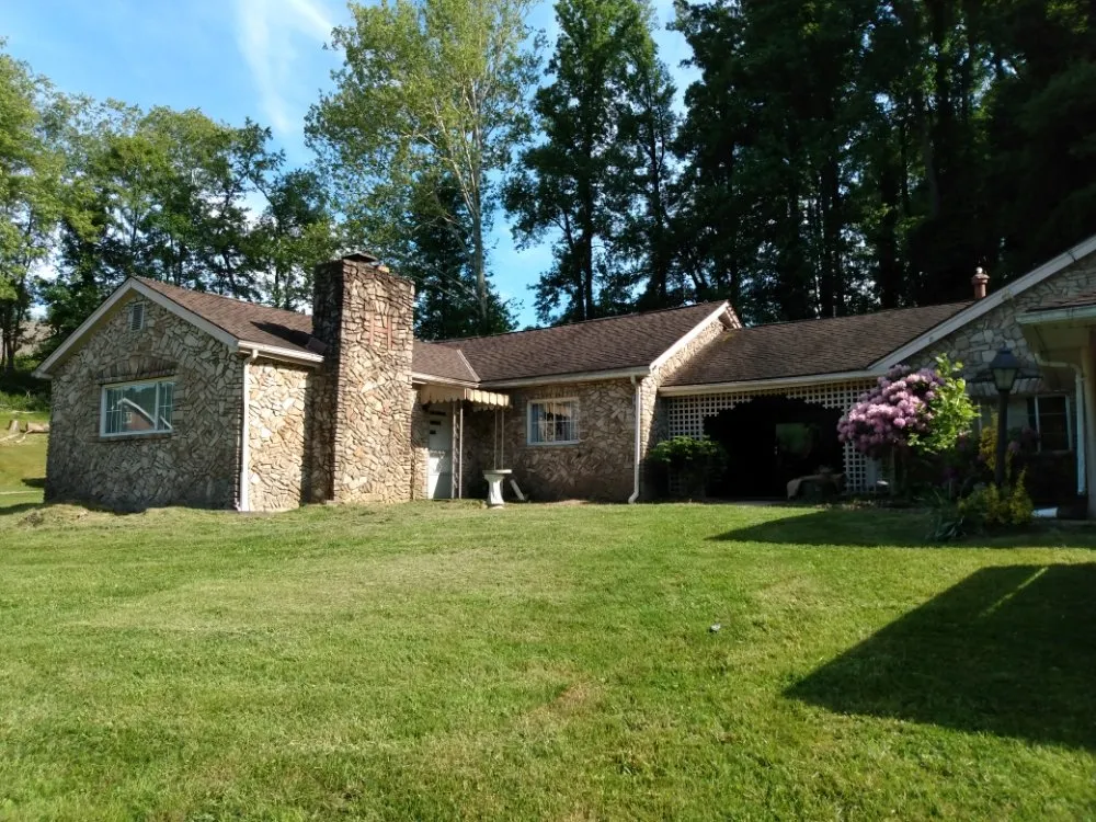 Licensed storm damage roof repair with free inspection in Tunnelton, WV by Skyward Tree Service & Maintenance