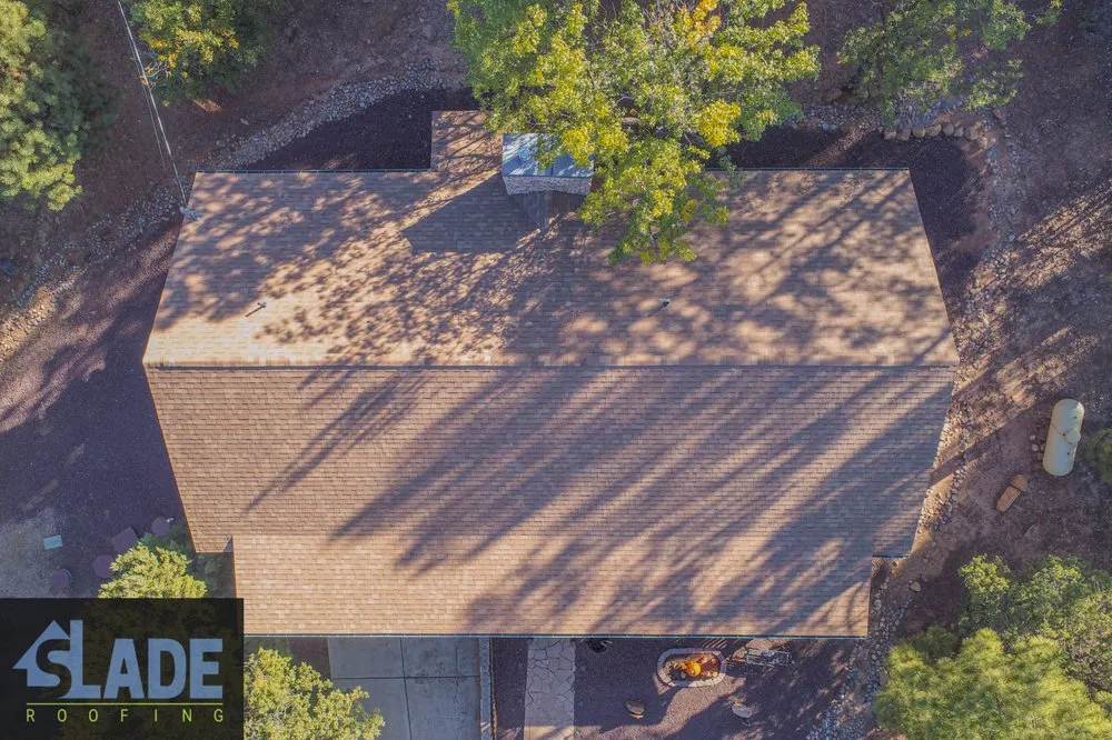 Emergency storm damage roof repair in Pinetop, AZ by Slade Roofing