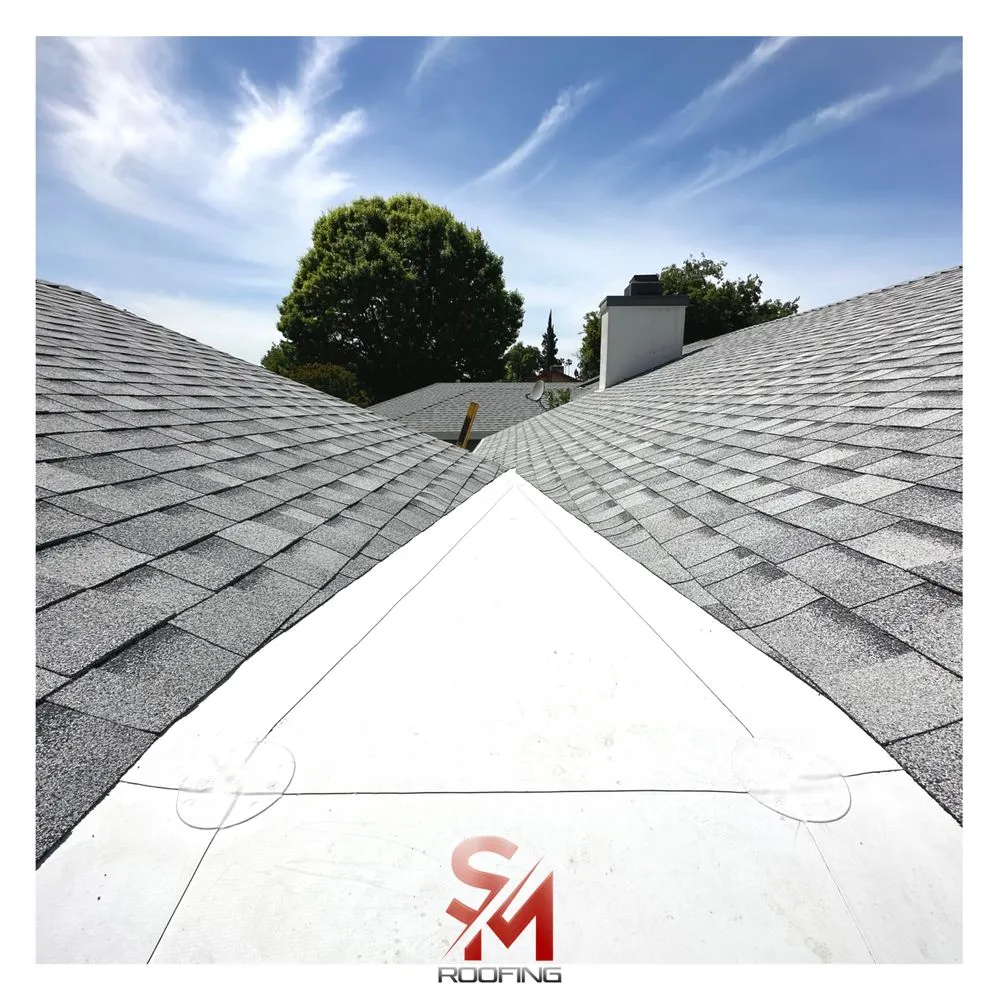 Slide of SM Roofing