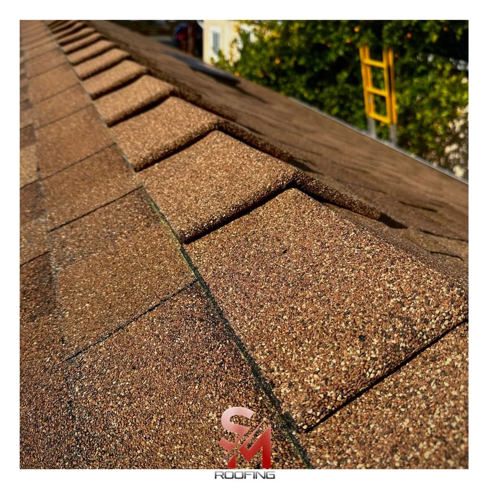 Slide of SM Roofing