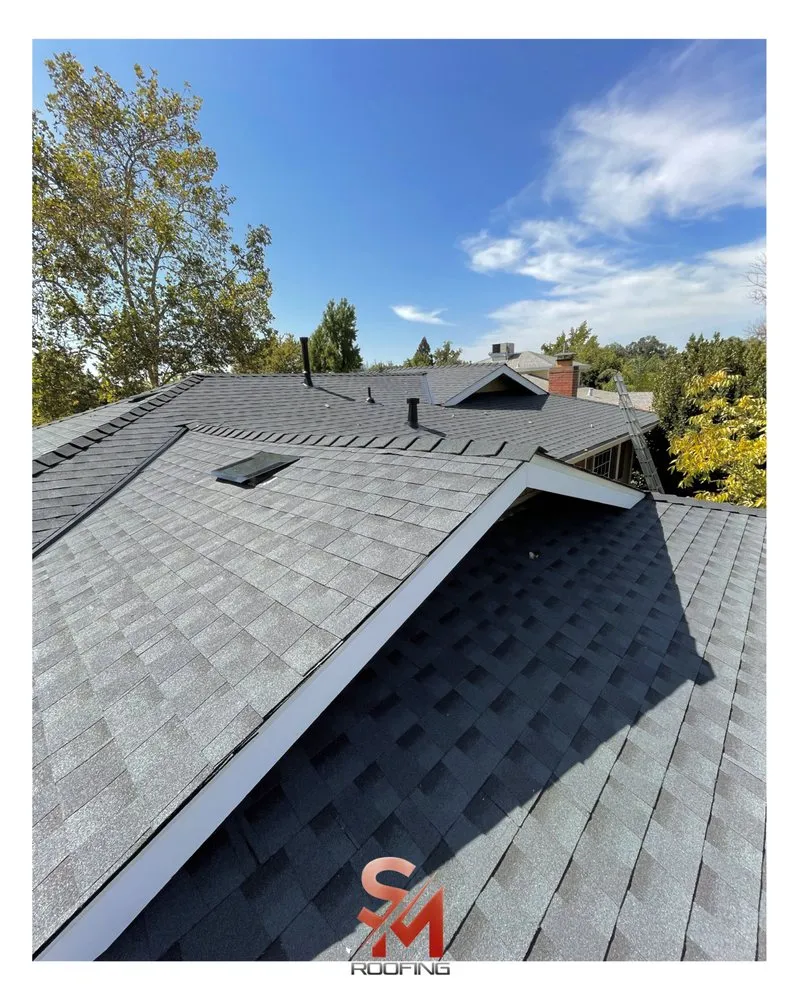 Slide of SM Roofing