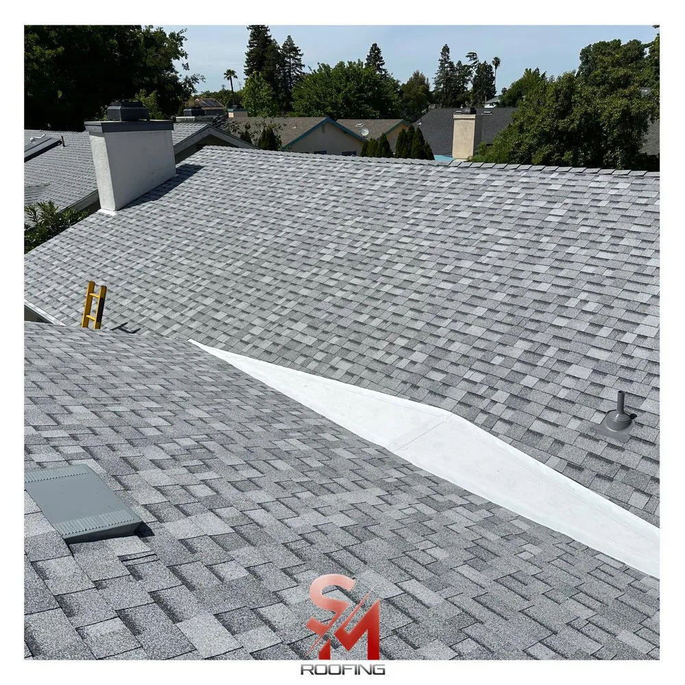 Slide of SM Roofing