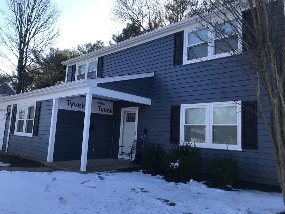 Slide of Snap Roofing Siding & Windows