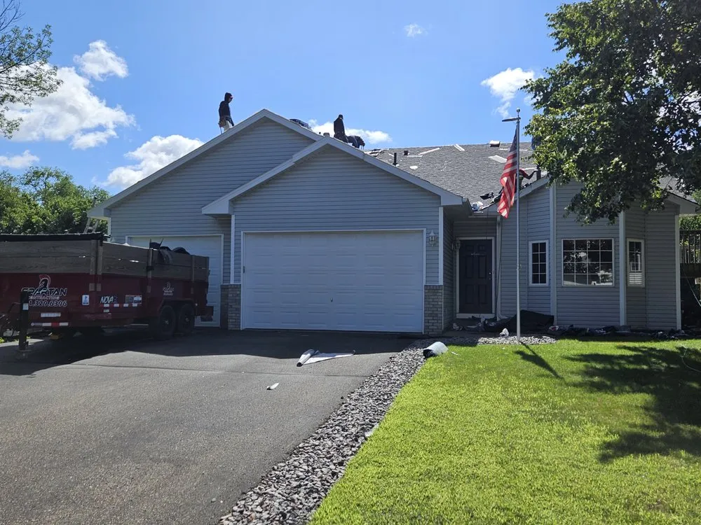 Licensed storm damage roof repair with free inspection in Marine on Saint Croix, MN by Spartan Contracting