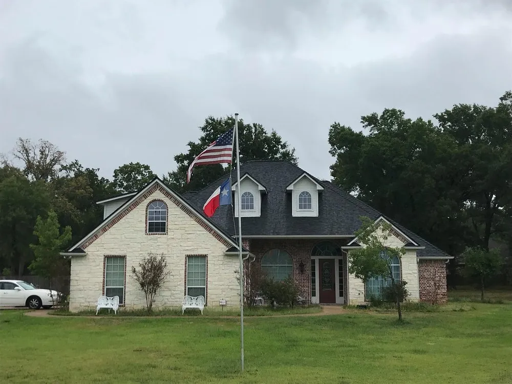 Top-rated residential roofing service after storm damage in Flint, TX by Spartan Exteriors 