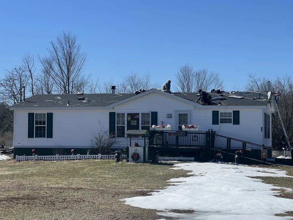 Slide of Spartan Roofing