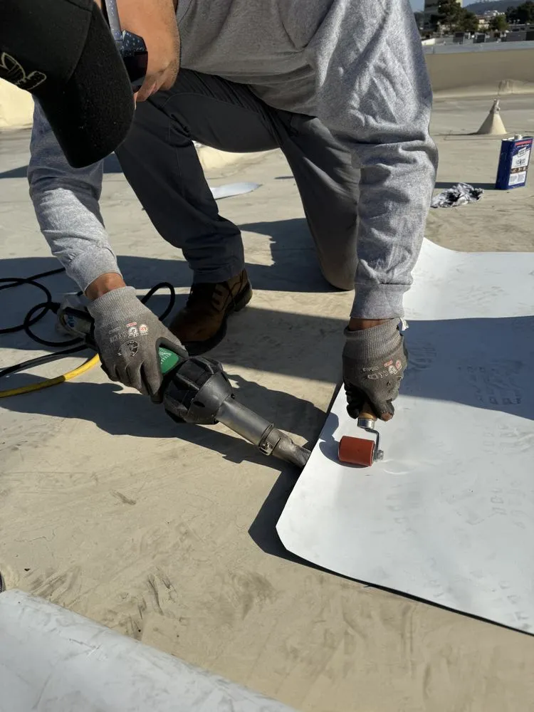 Slide of Spootless Roofing