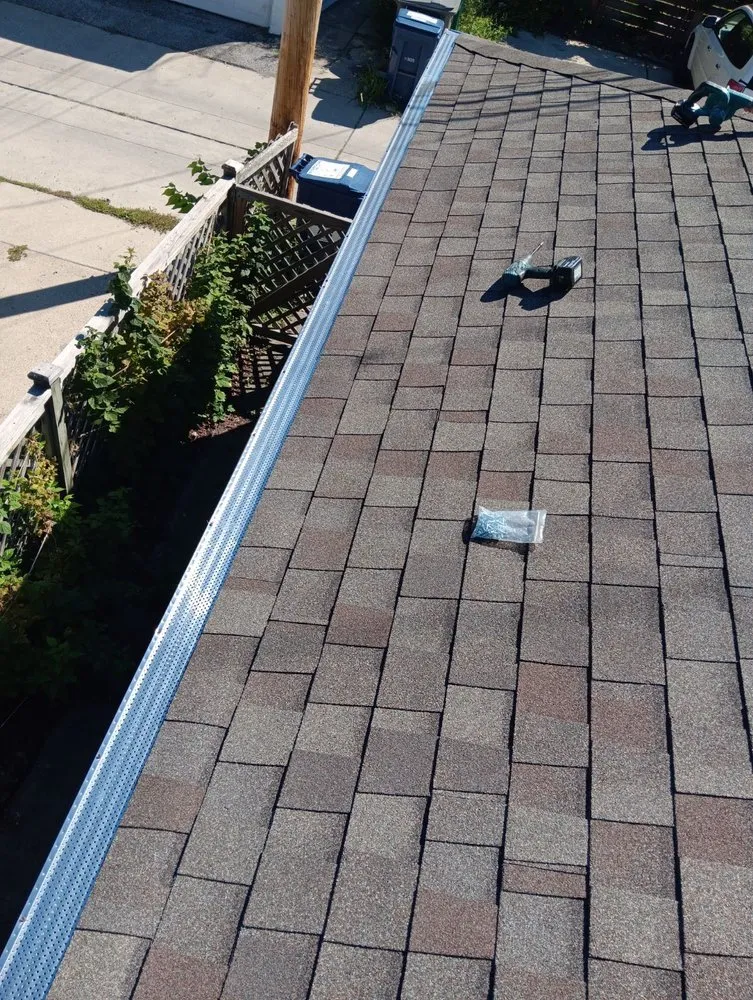 Slide of Squeegees Roofing & Construction