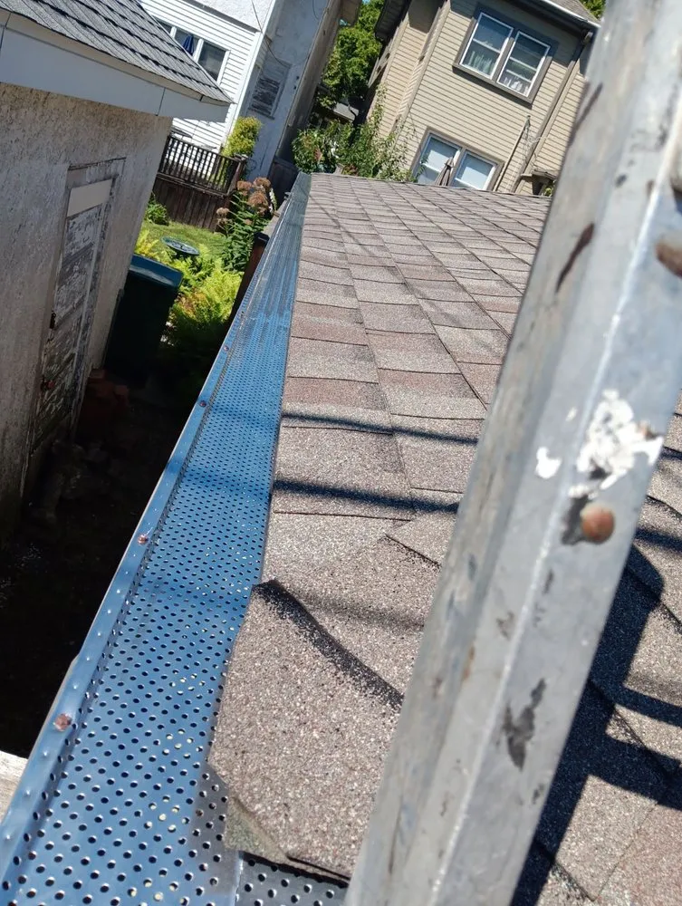 Slide of Squeegees Roofing & Construction