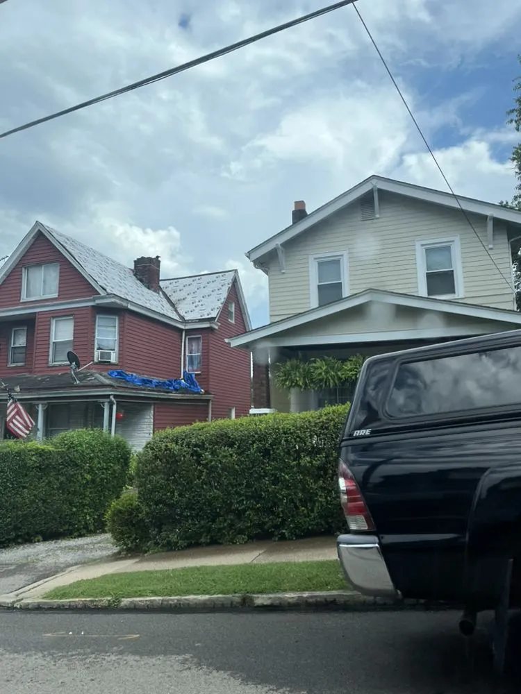 Slide of Steel City Roofers